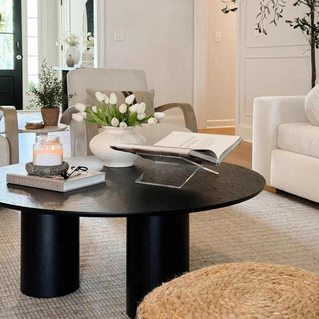 Baguette Modern Black Oak Coffee Table in living room with beige sofas and light carpet flooring.