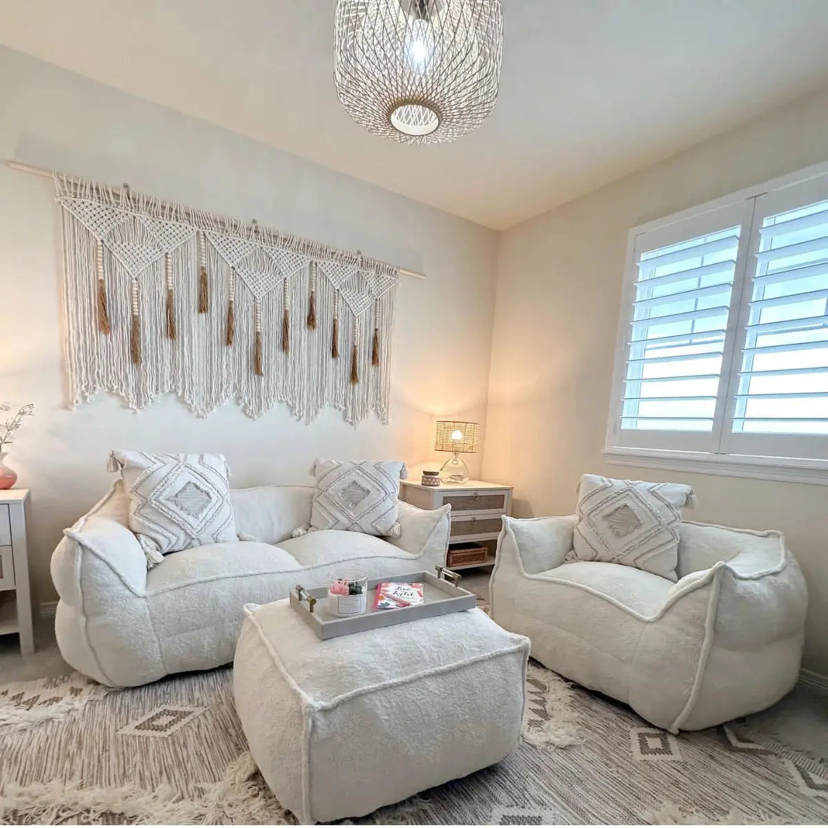 Boring Teddy fabric bean bag chair set in cozy living room with macrame wall hanging and rug.