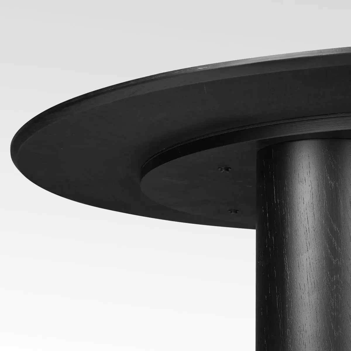 Close-up detail of Baguette Modern Oak Wood Round Dining Table's sleek 3-leg design.