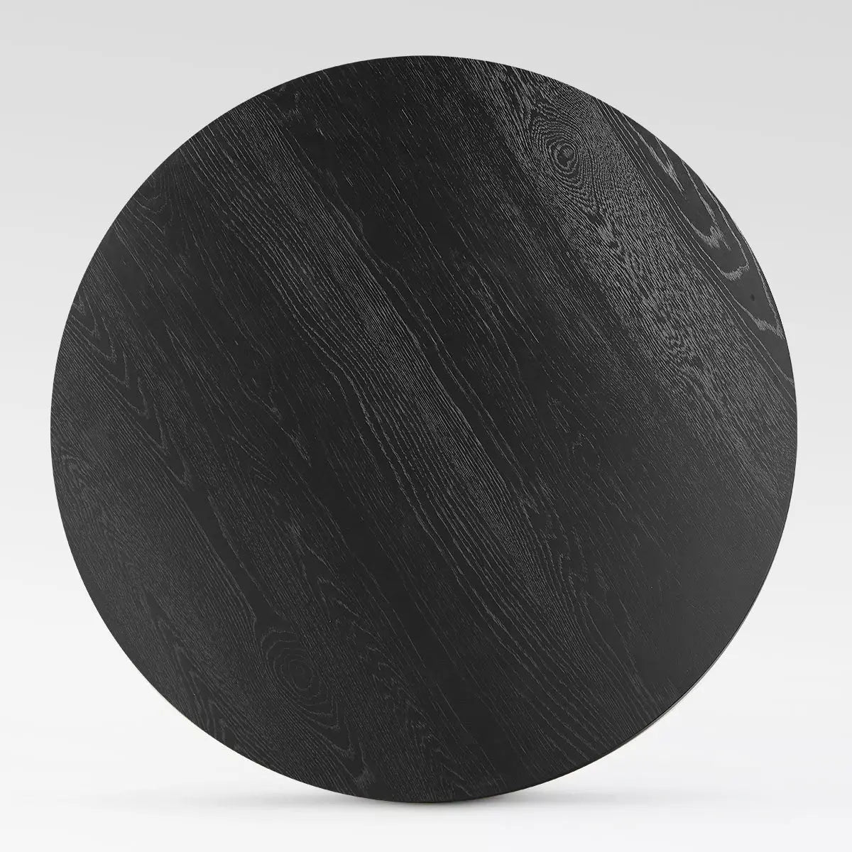 Top view of Baguette Modern Oak Wood Dining Table, black finish, round shape.