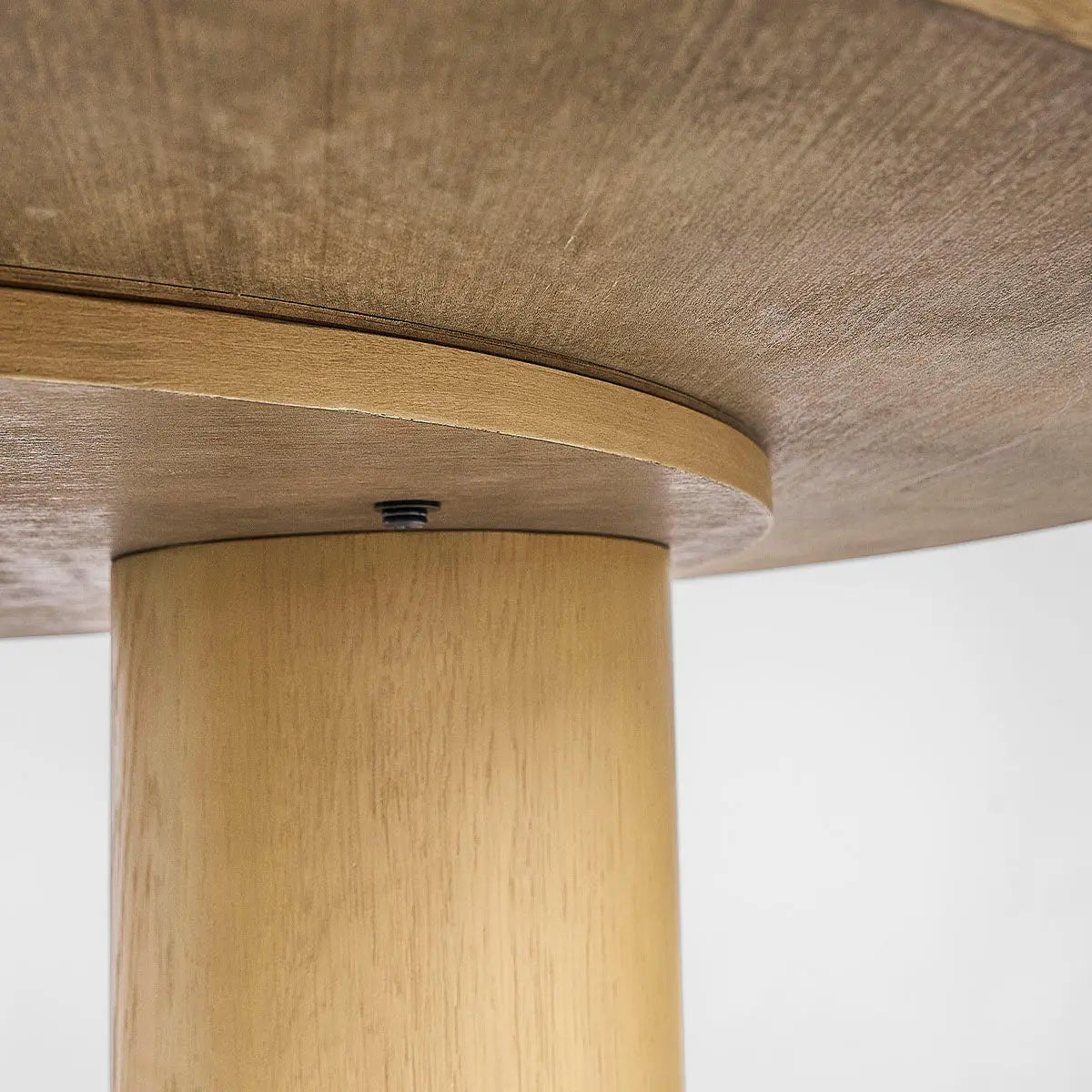 Close-up view of Baguette Modern Oak Wood Dining Table base and wood texture detail.