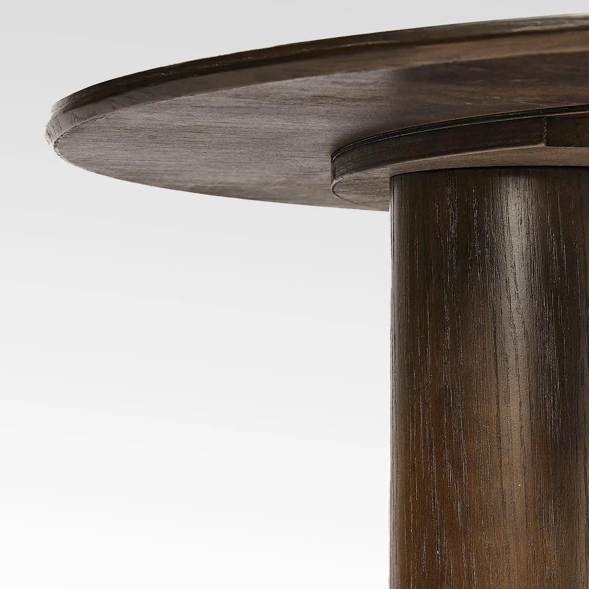 Close-up of oak wood detail on Baguette Modern 3-Leg Round Dining Table.