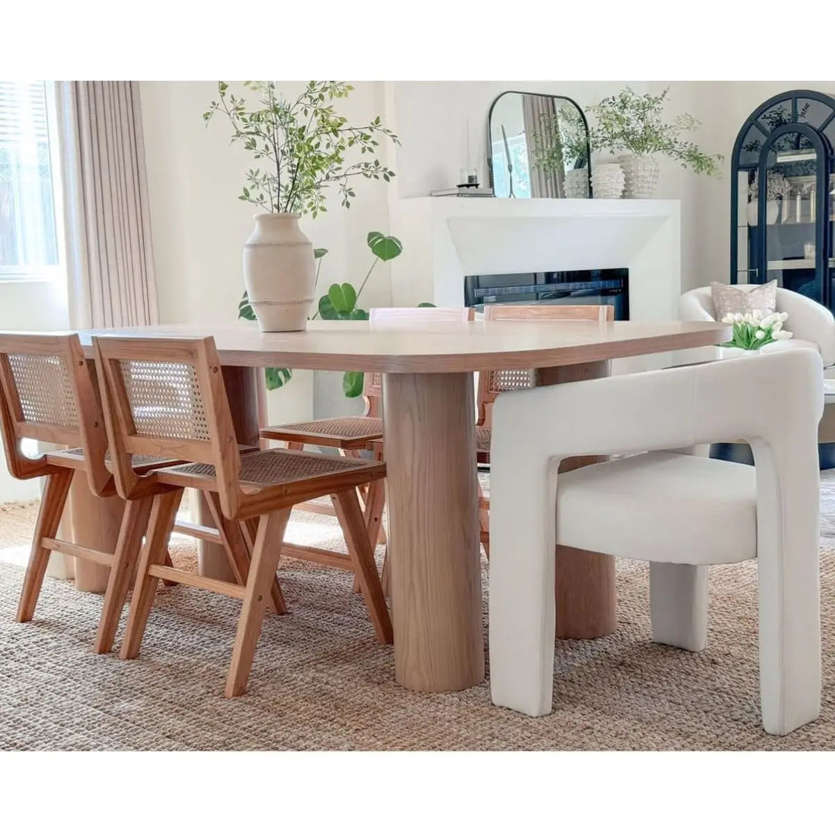 Baguette Modern Rectangle Oak Dining Table with wooden chairs, neutral room, woven rug flooring.