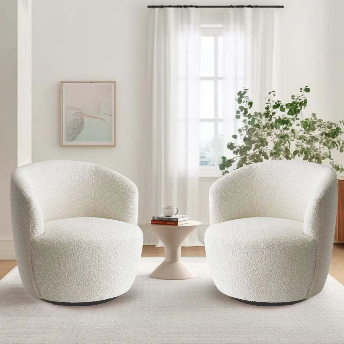 Modern white boucle swivel barrel chairs in bright living room with white curtains and light wood floor.