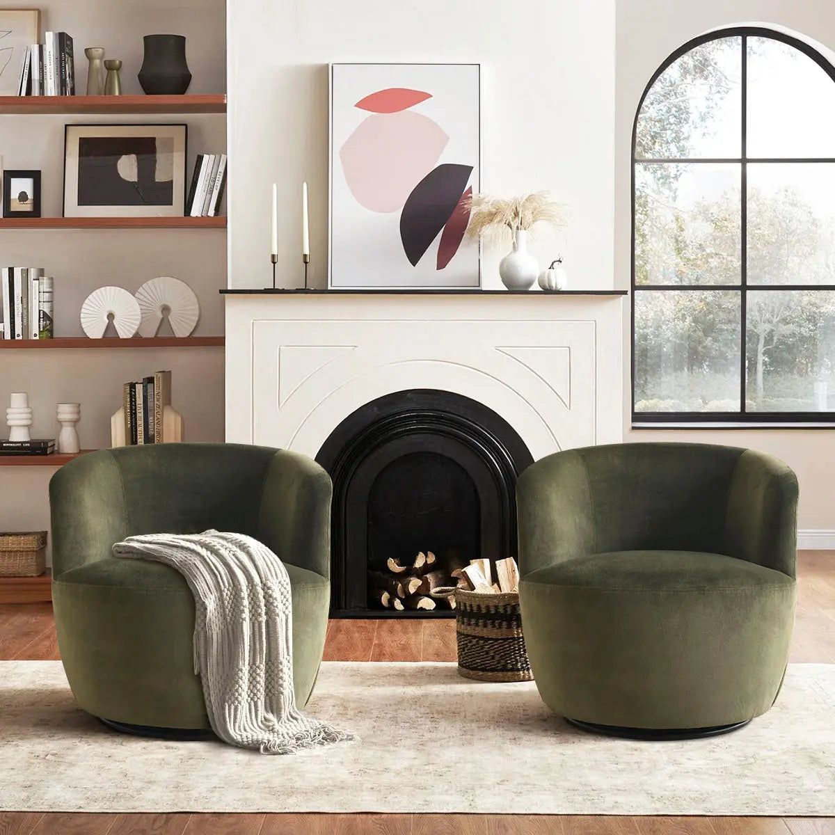 Bella Modern Olive Green Velvet Swivel Barrel Chairs in cozy living room with fireplace and hardwood floors.