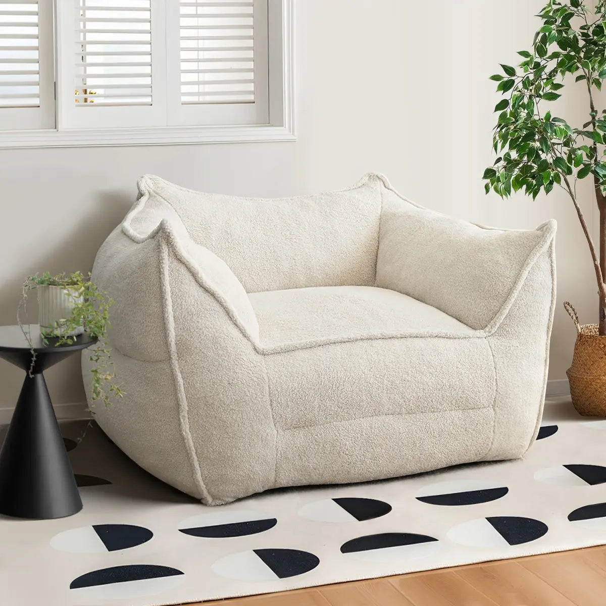 Beige Boring Teddy Bean Bag Chair in cozy room with modern rug, wooden floor, and potted plant.