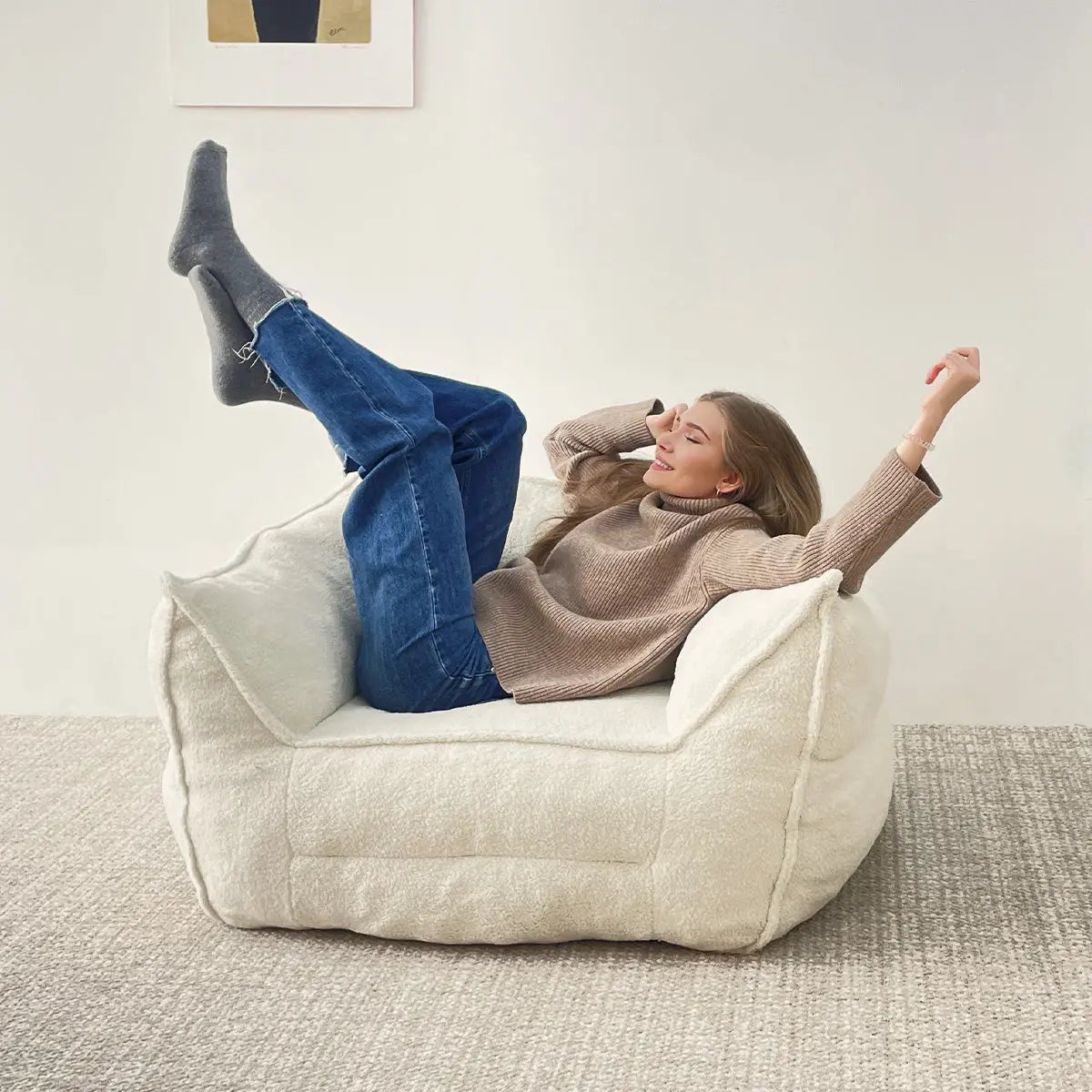 Boring Upholstered Teddy Fabric Bean Bag Chair in cozy room, beige carpet, white wall, artwork.