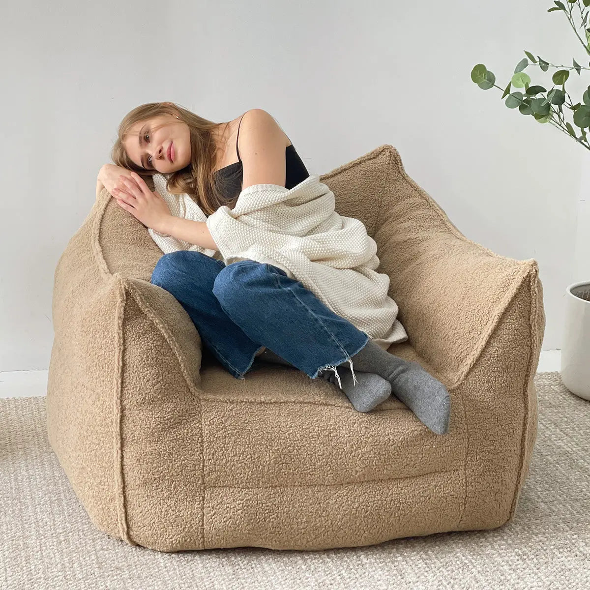 Boring Upholstered Teddy Fabric Bean Bag Chair in cozy room with neutral carpet and minimal decor.