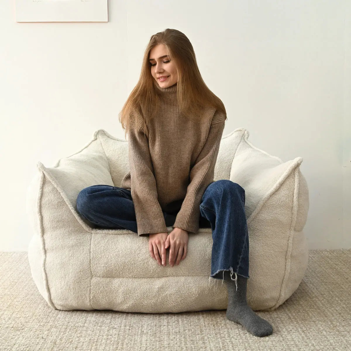 Boring Upholstered Teddy Fabric Bean Bag Chair in neutral room with textured carpet flooring.