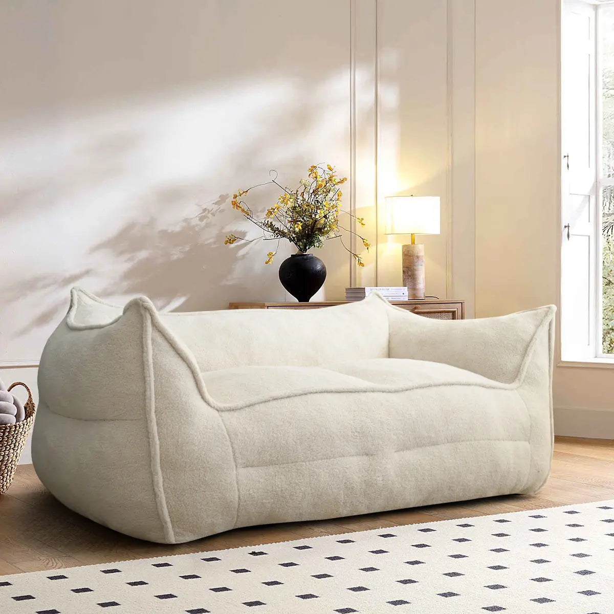 Cream Boring Teddy Bean Bag Chair in stylish living room with wooden flooring and white walls.