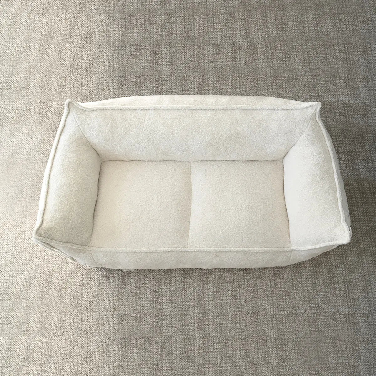 Boring Large Teddy Fabric Bean Bag Loveseat Sofa on beige carpet flooring.