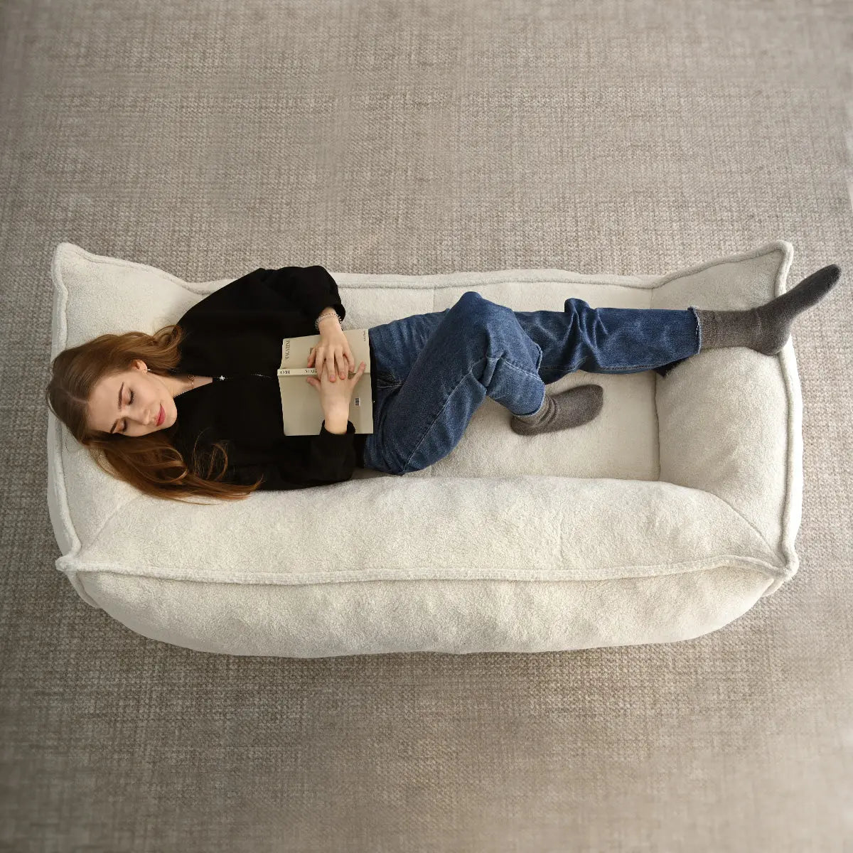 Cozy Boring Large Teddy Fabric Bean Bag Loveseat Sofa on soft textured carpet in neutral room.