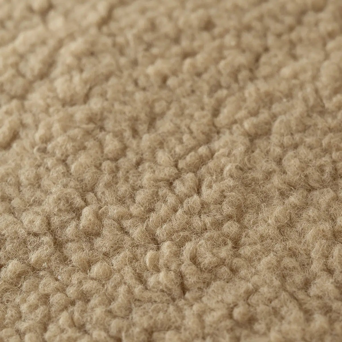 Close-up texture of Boring Teddy Fabric Square Bean Bag Ottoman, showcasing soft and cozy material.