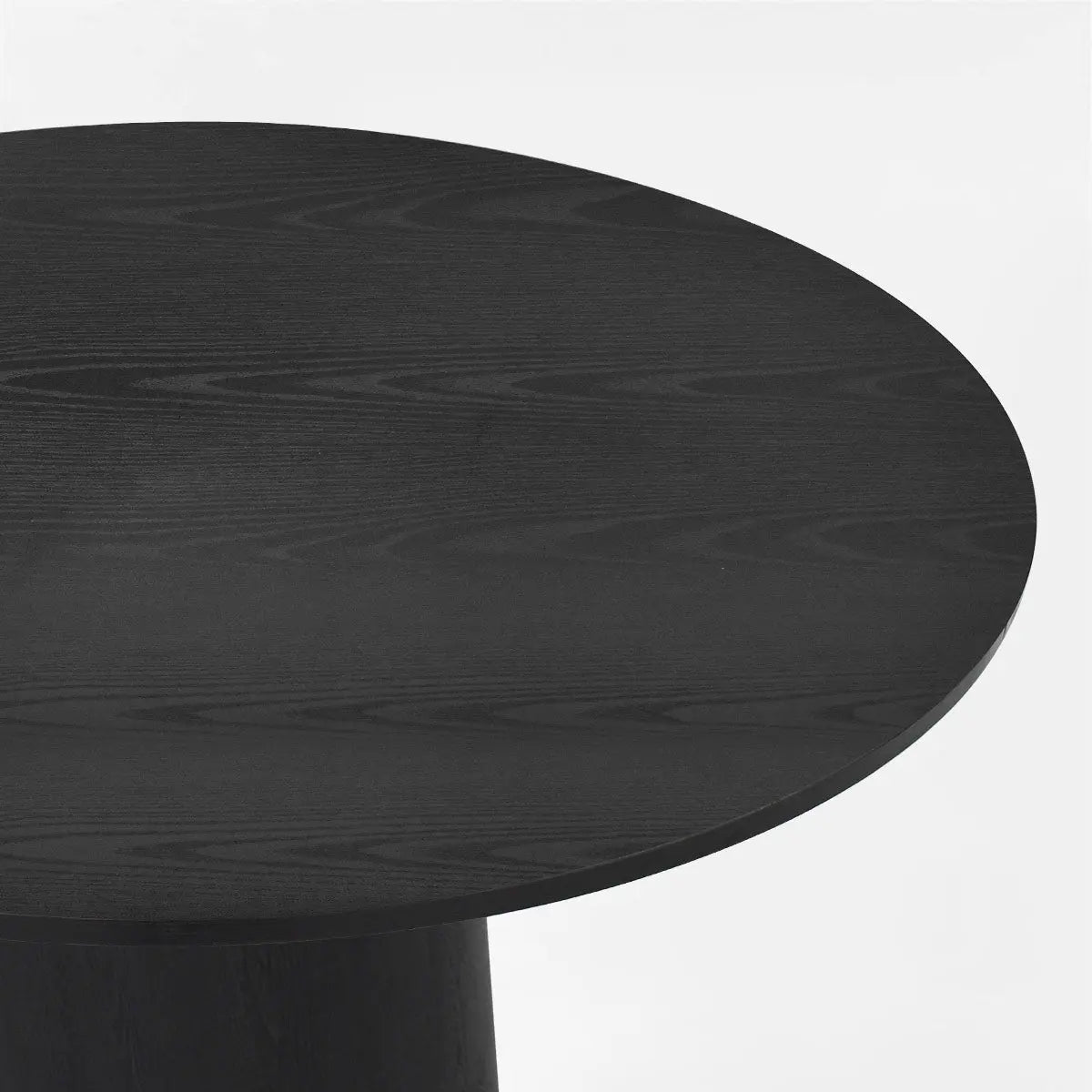 Black Dwen Modern Round Pedestal Dining Table, elegant wood grain, close-up view of tabletop.