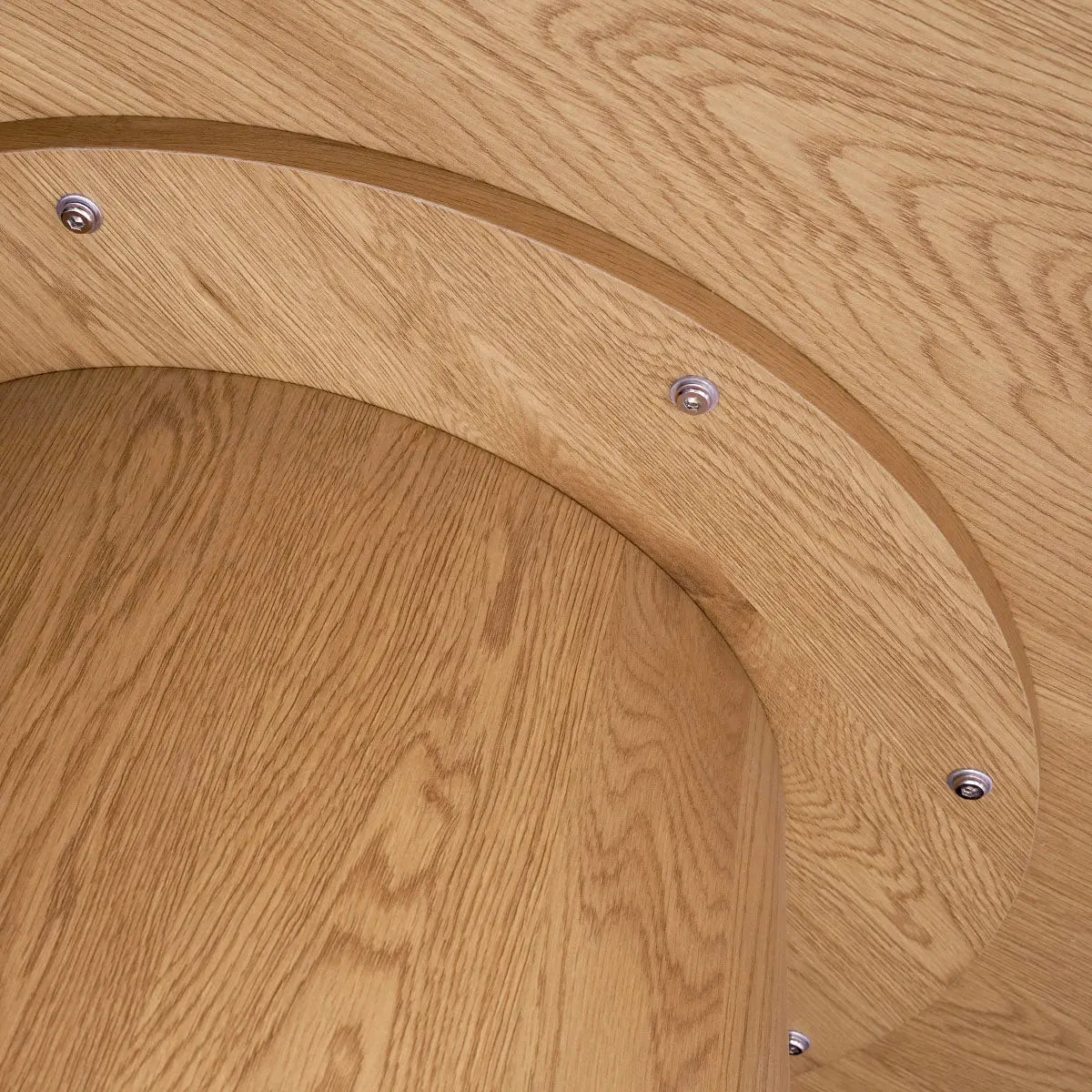 Close-up of wooden table design from Dwen & Nice Round Rattan & Beige Dining Table Set.