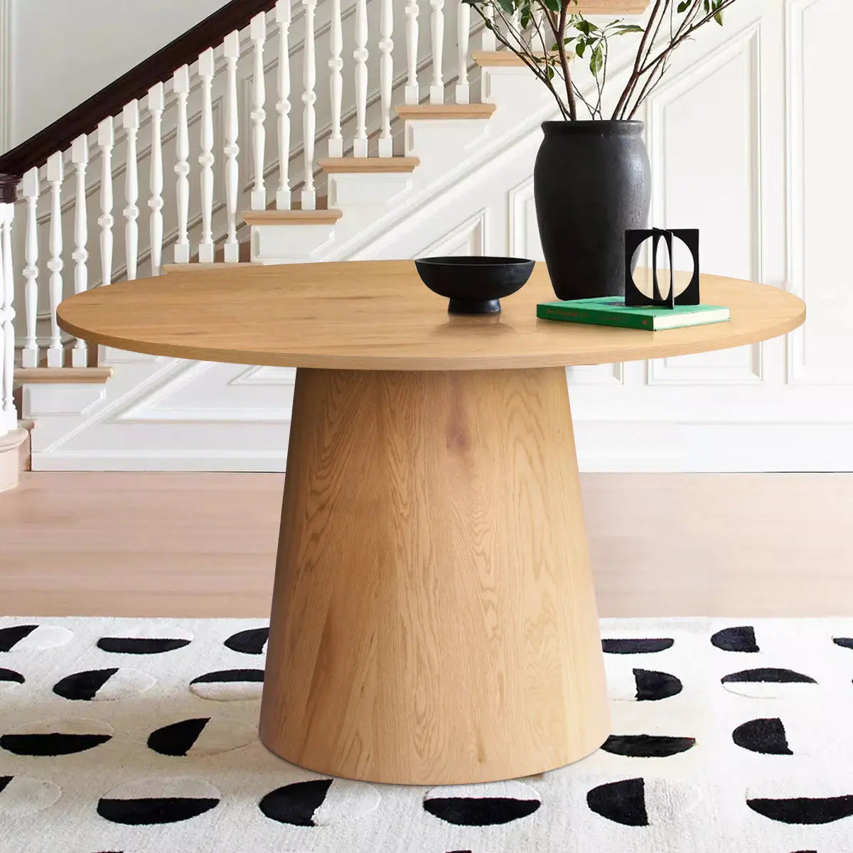 Dwen & Nice Round Rattan Dining Table Set, beige, staircase backdrop, wooden flooring, modern decor.