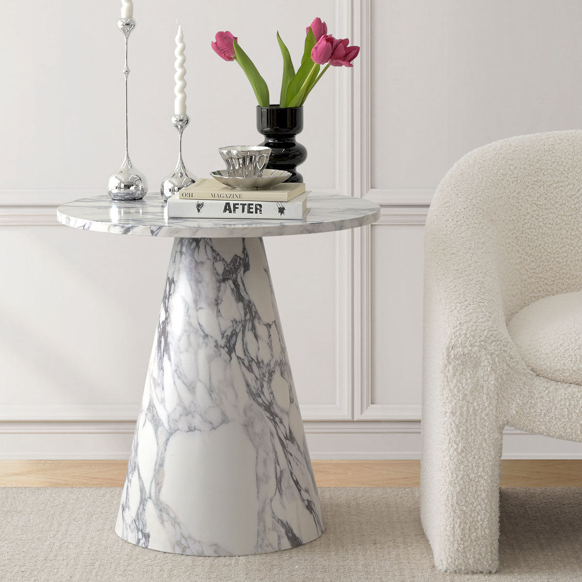 Dwen Marble Round Pedestal Side Table in elegant room with white textured sofa and light wood floor.