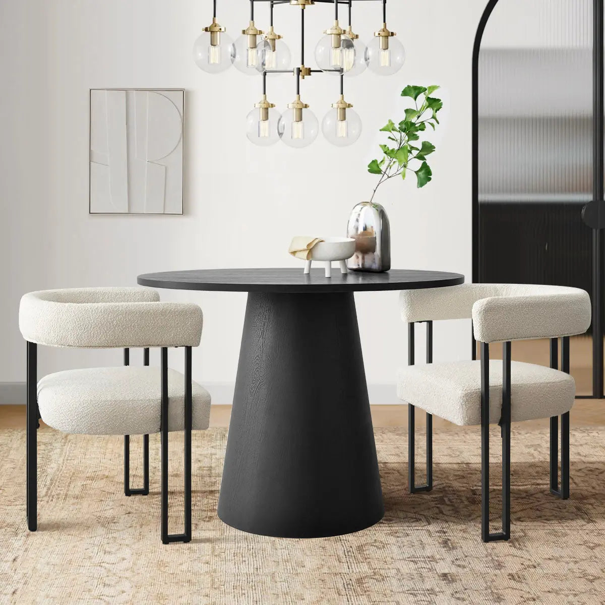 Dwen & Mia 35" round dining table set with beige chairs, black table, modern light fixture.