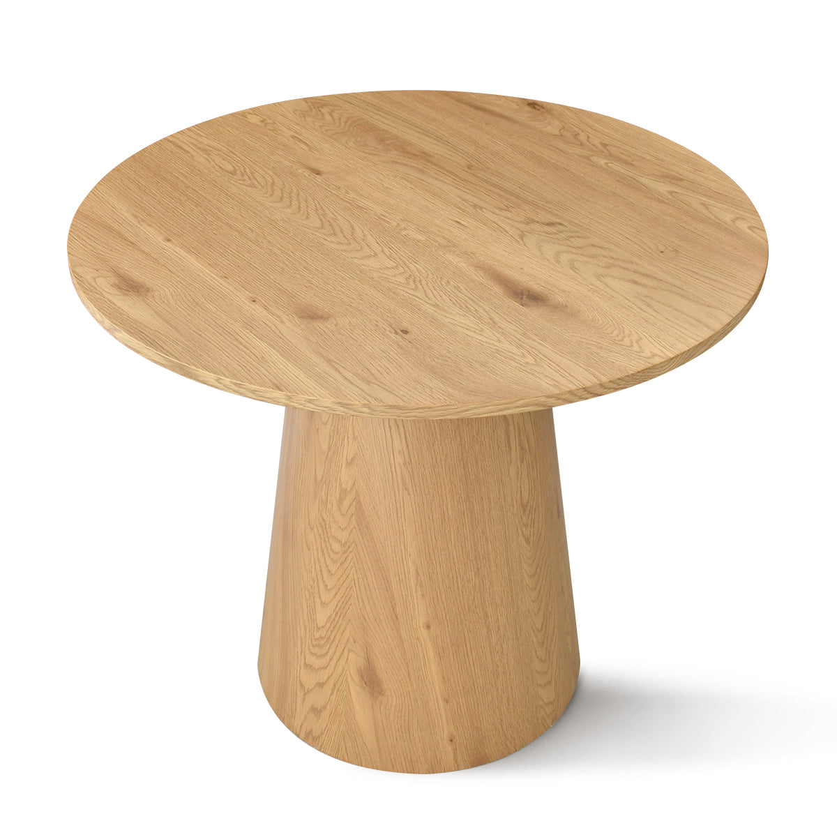 Dwen Modern Round Pedestal Dining Table in a minimalist room setting, visible light wood finish.