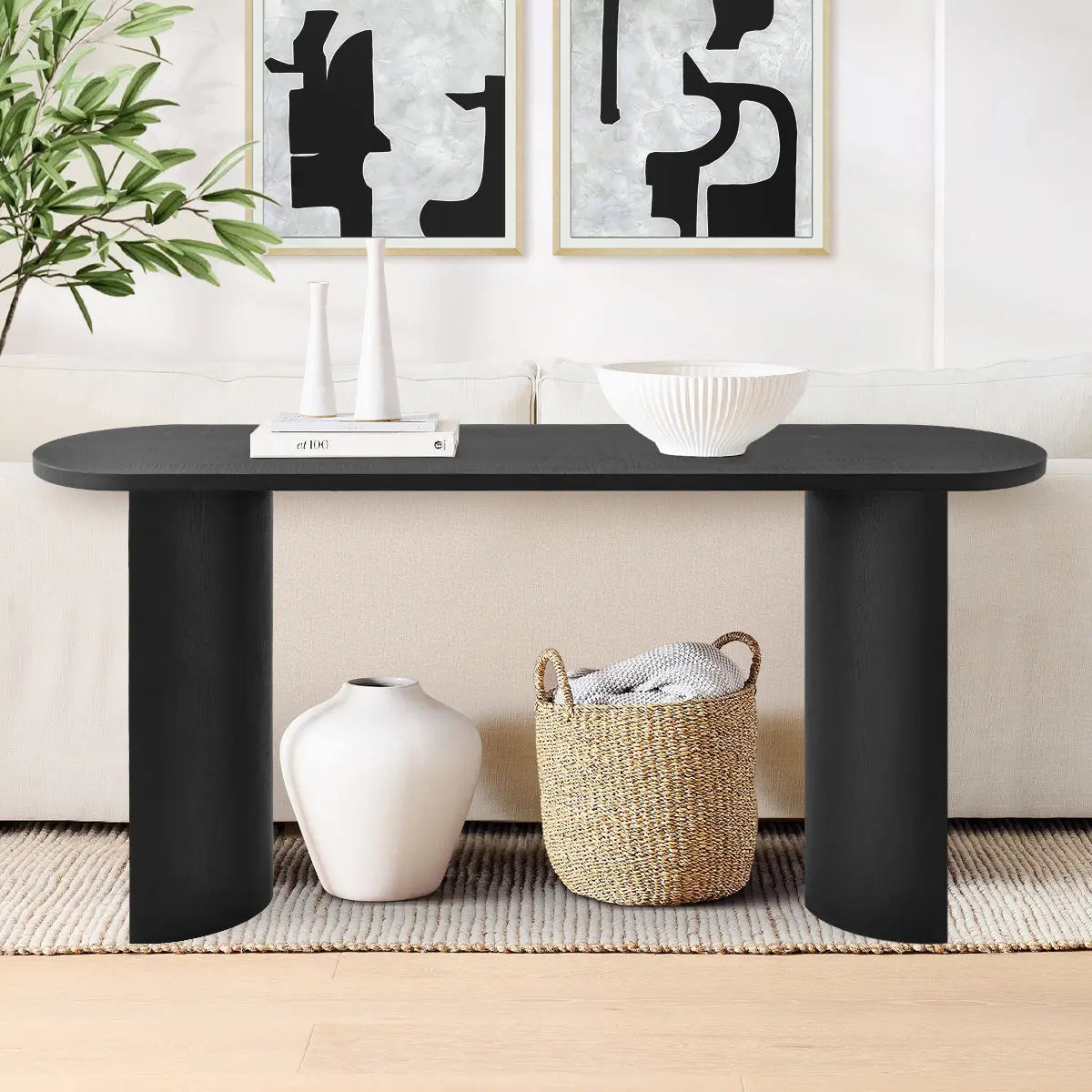 Dwen Modern Oval Console Table in living room with beige sofa, abstract art, light wood flooring.