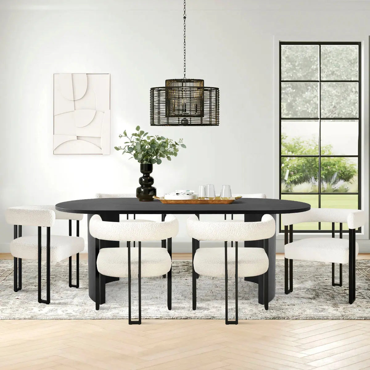 Dwen & Mia modern oval dining table set with beige chairs, herringbone wood flooring, and artistic decor.