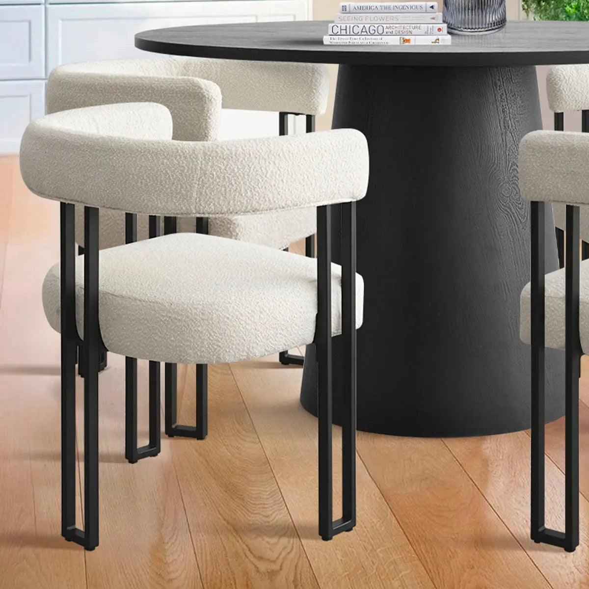 Dwen & Mia round dining set, black and beige, wood flooring, modern chairs, kitchen setting.