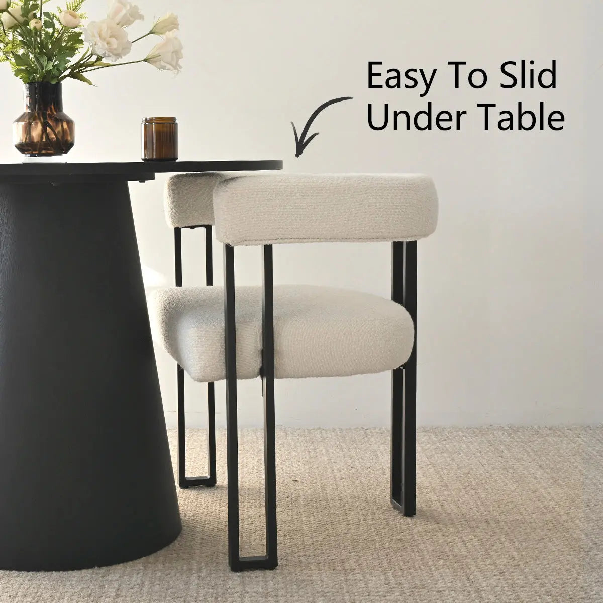 Dwen & Mia dining table set with beige chairs, black round table, on textured carpet flooring.