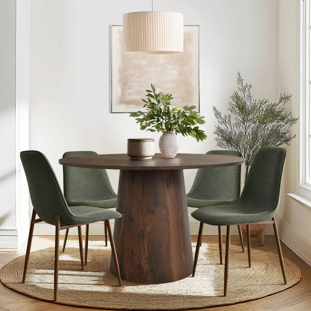 Dwen & Oslo dining table set with green chairs in cozy dining room; modern, minimalist decor.