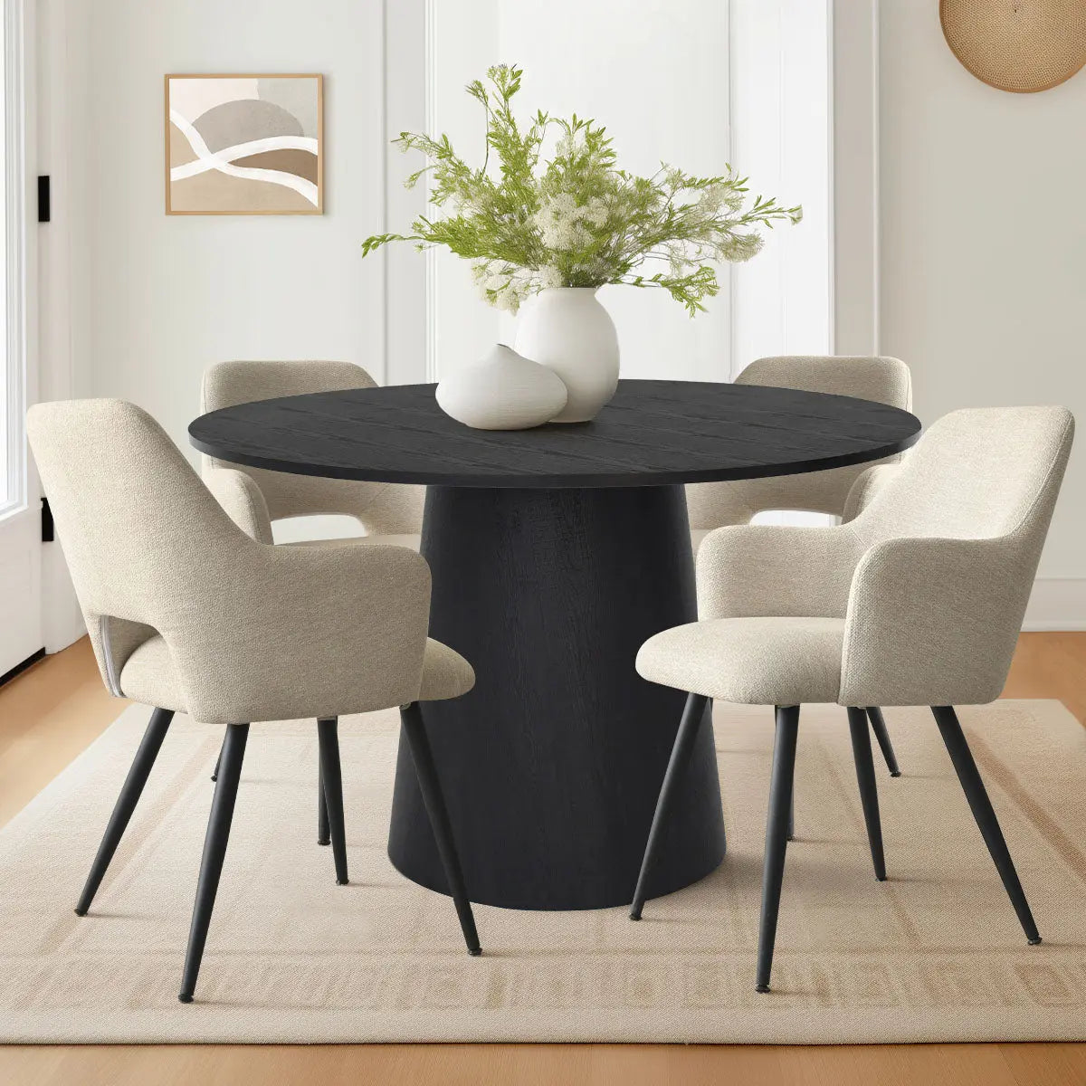 Dwen & Edwin 46" black dining set with beige chairs, white walls, tan rug, modern decor.