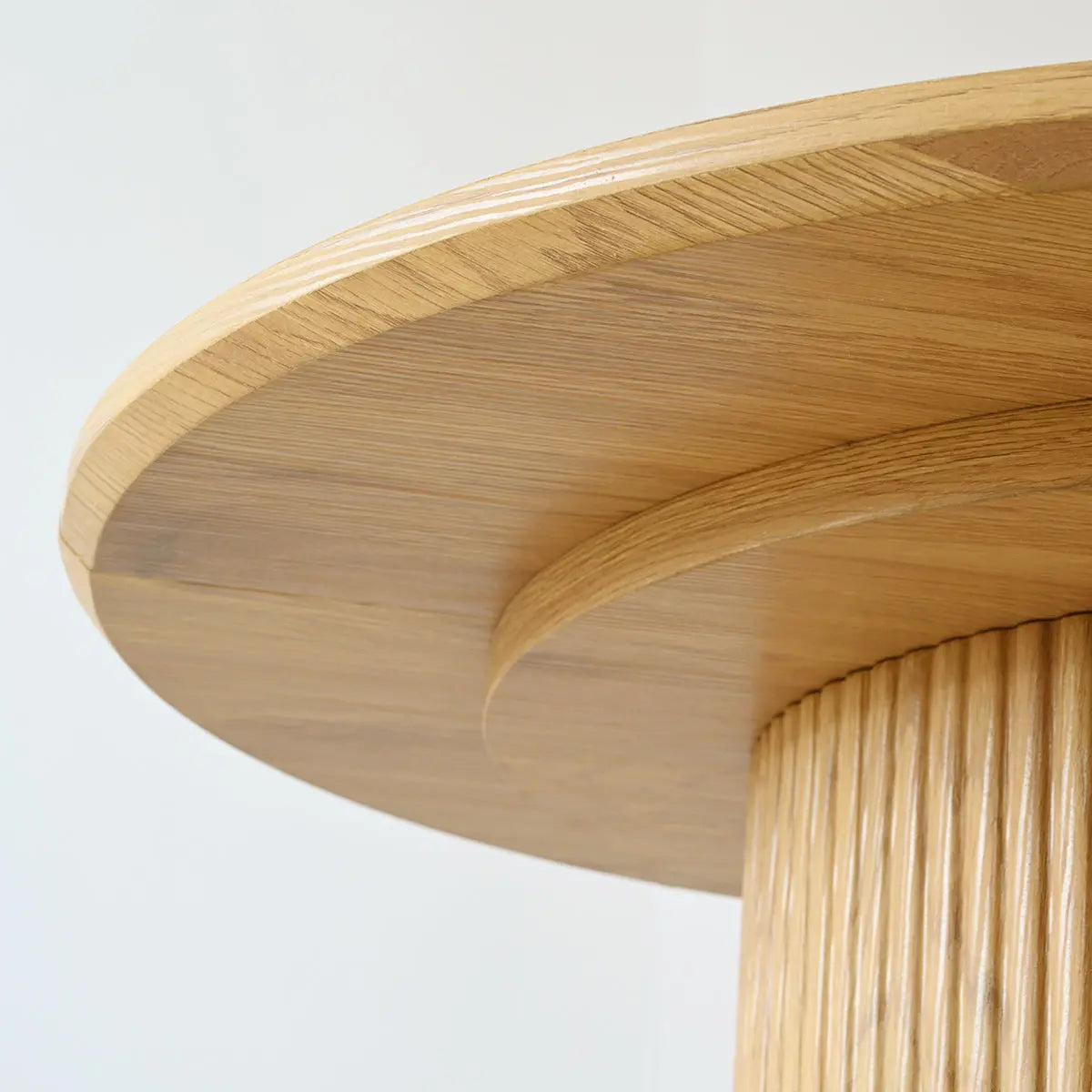 Close-up of Dwen Modern Large Roman Pillar Oval Dining Table showcasing wood texture and design.