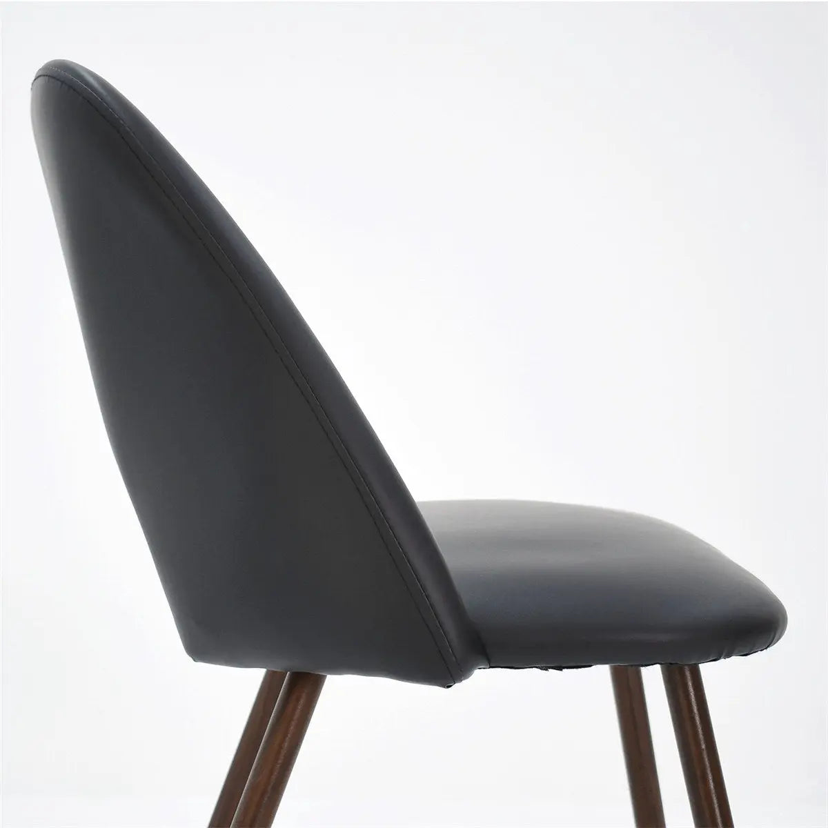 Edwin Modern Leather Dining Chair side view, stylish design, dark upholstery, wooden legs.