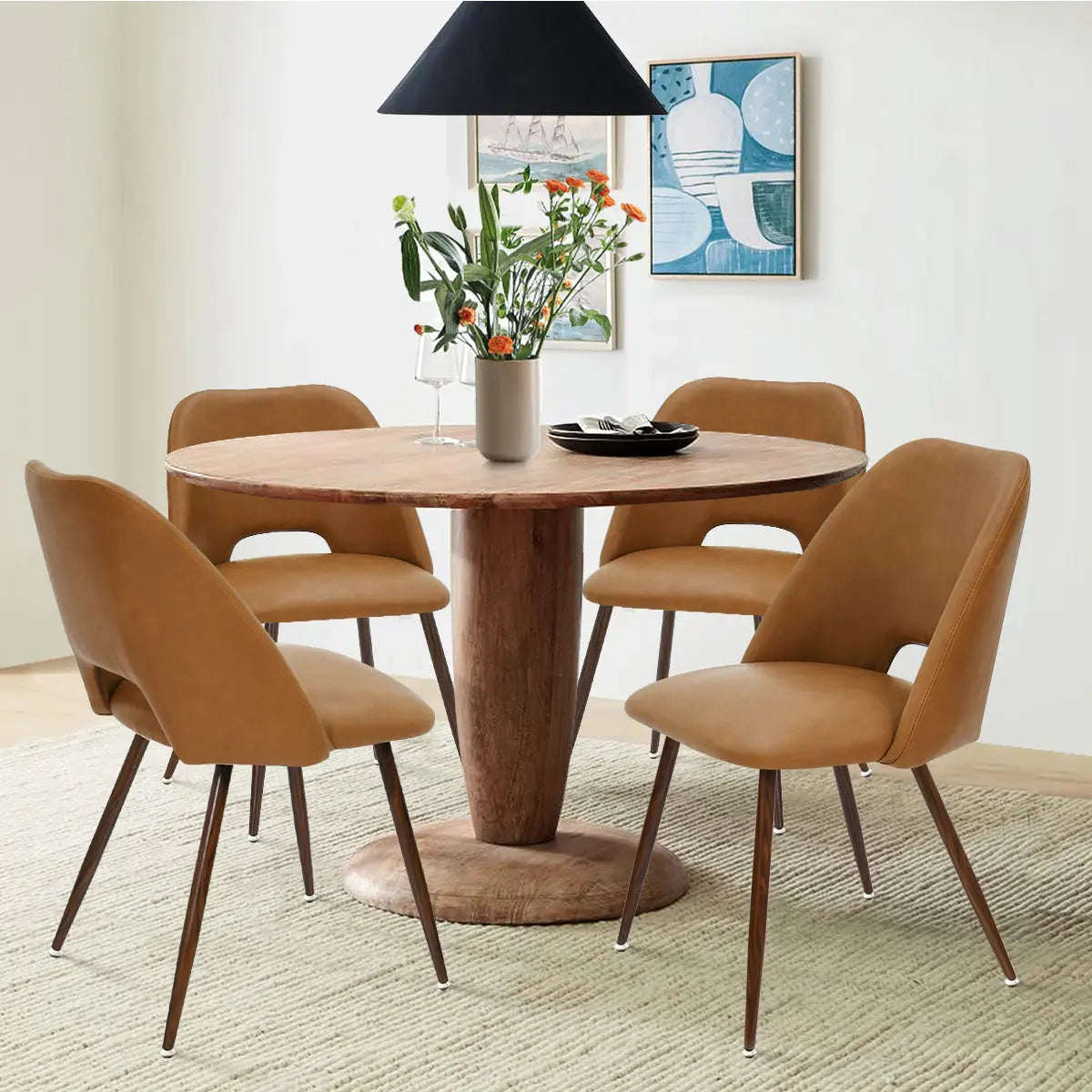 Edwin Modern Leather Dining Chair set around wooden table in stylish dining room with beige rug.