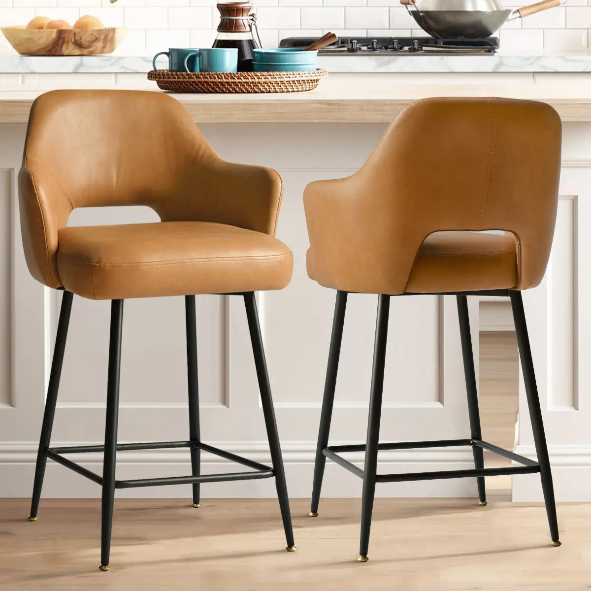 Edward Leather Counter Stool with Arms in kitchen, light wood flooring, white paneled wall.