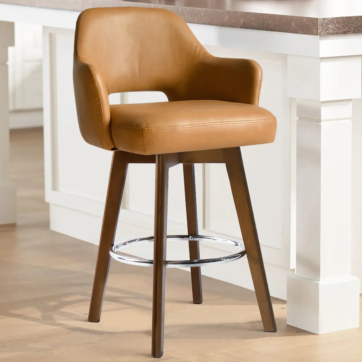 Edward Leather Swivel Counter Stool with Arms in kitchen, light wood flooring, white cabinetry.