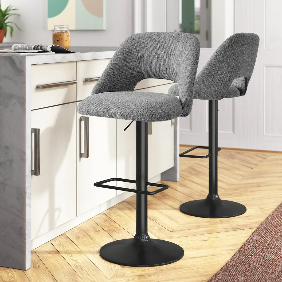 Edwin Modern Upholstered Swivel Adjustable Counter Stool in kitchen with wooden flooring, gray cabinets.