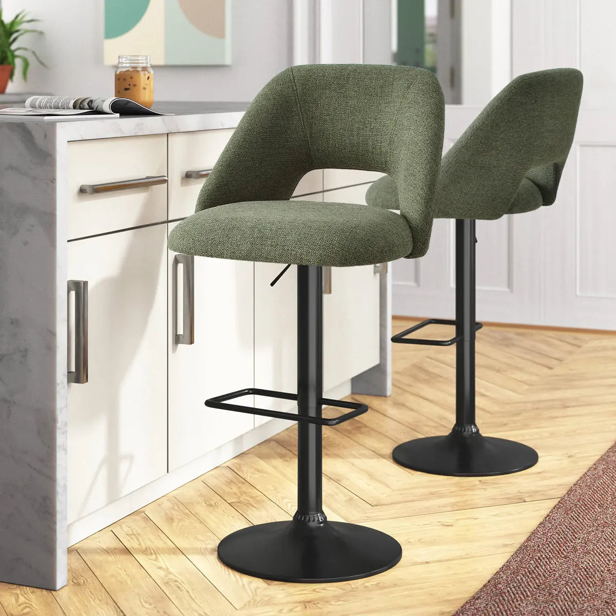 Edwin Modern Upholstered Swivel Adjustable Counter Stool in kitchen with herringbone wood flooring.