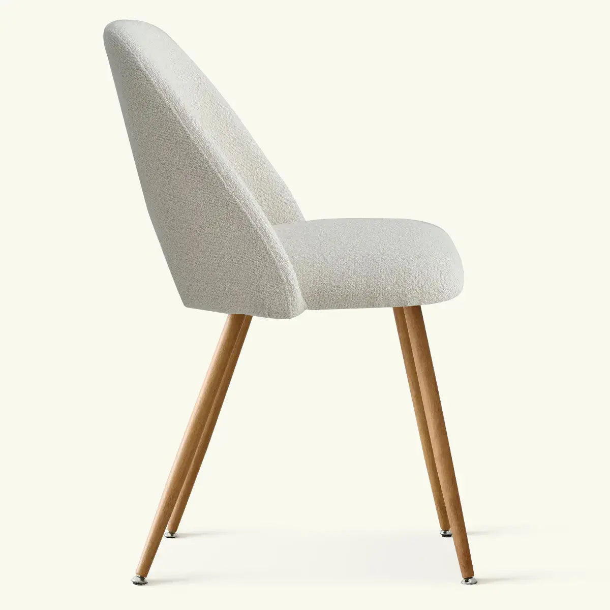 Edwin Modern Boucle Upholstered Dining Chair with wood legs, side view. Minimalist design.