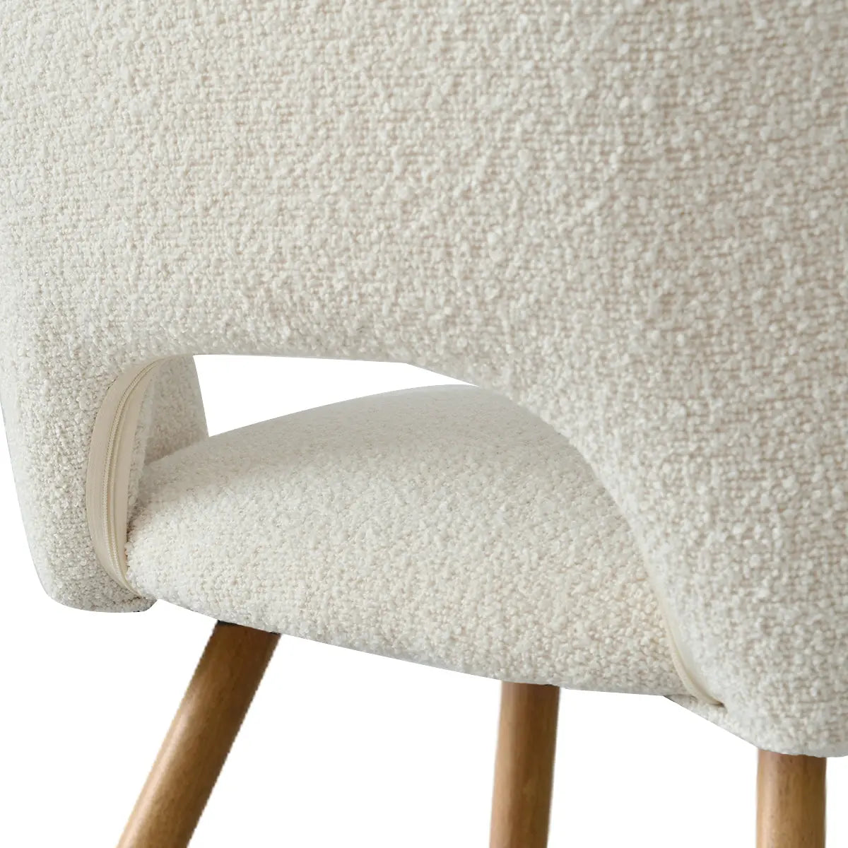 Close-up of dining chair texture from Dwen & Edwin Modern Round Dining Table Set, wooden legs.