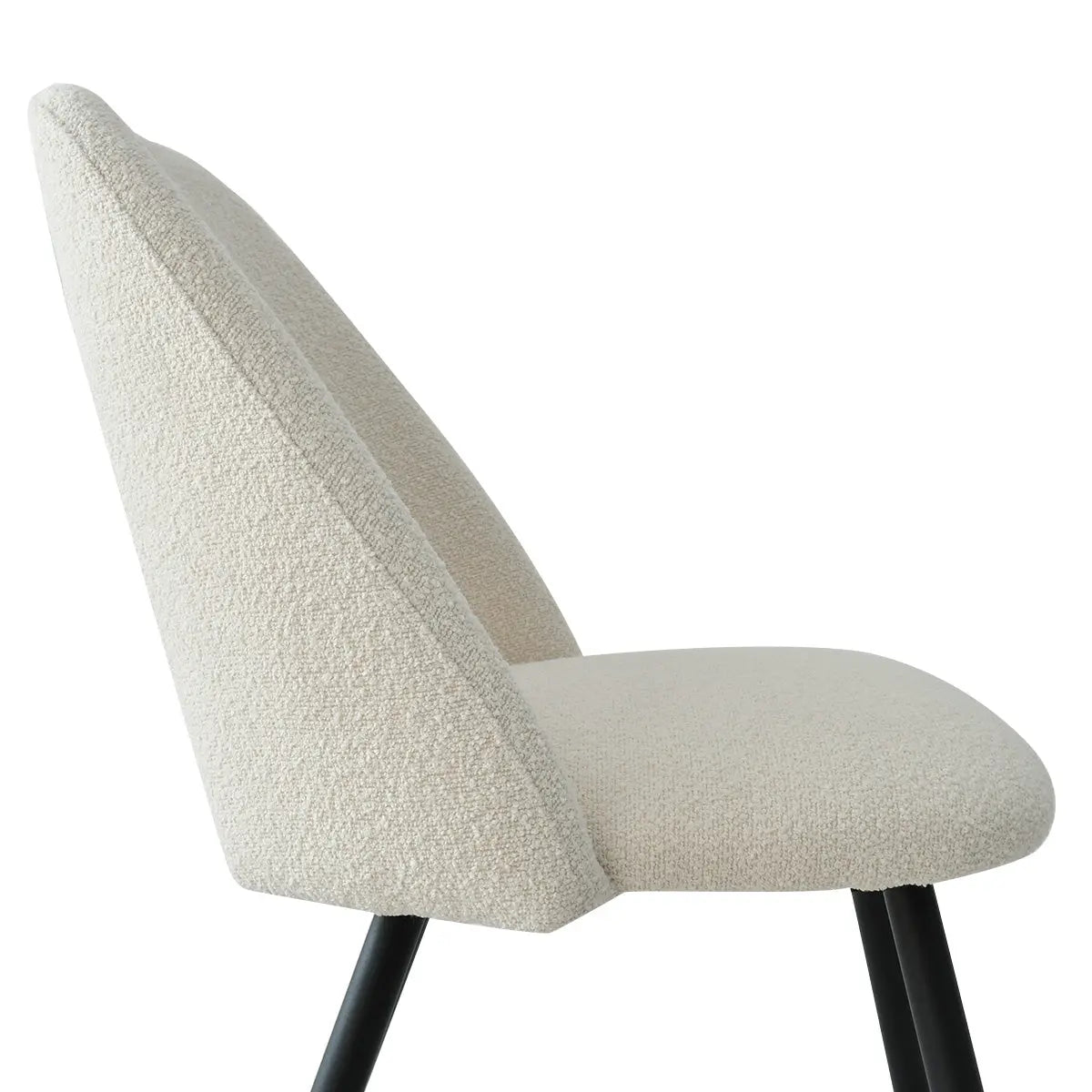 Edwin Modern Upholstered Dining Chair, cream fabric, black metal legs, ergonomic design, close-up side view.