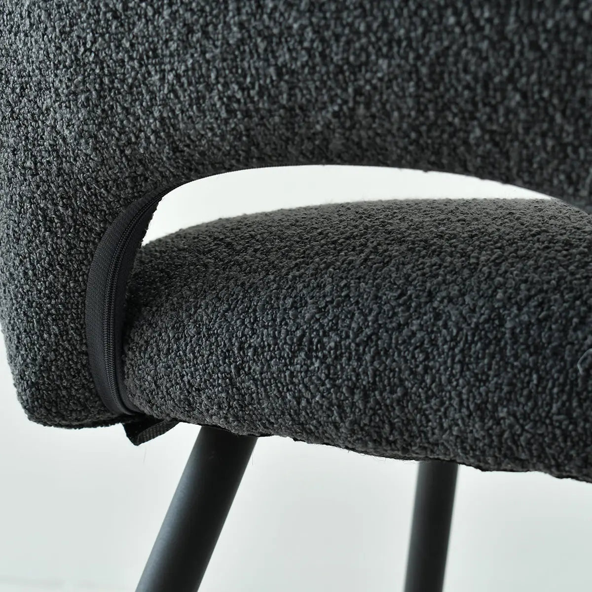 Close-up of gray Edwin Modern Upholstered Dining Chair with metal legs; textured fabric detail.