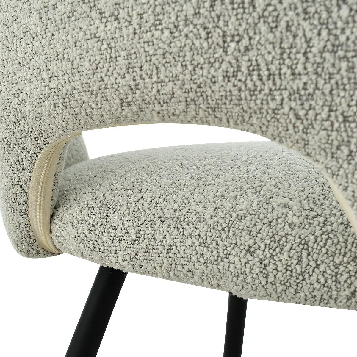 Close-up of textured upholstery on Edwin Modern Dining Chair with black metal legs.