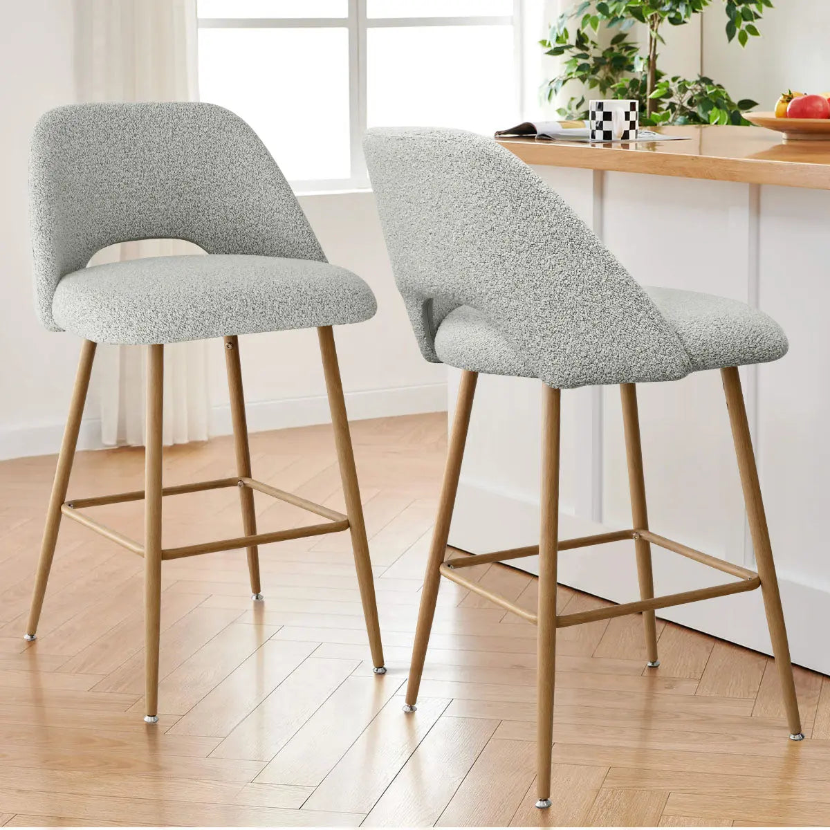 Edwin Modern Boucle Counter Stool with oak legs in kitchen; light wooden flooring, white walls.