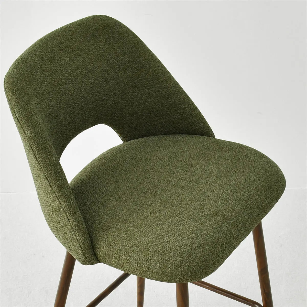 Green Edwin Modern Upholstered Counter Stool on light floor with wood legs, indoor furniture setting.