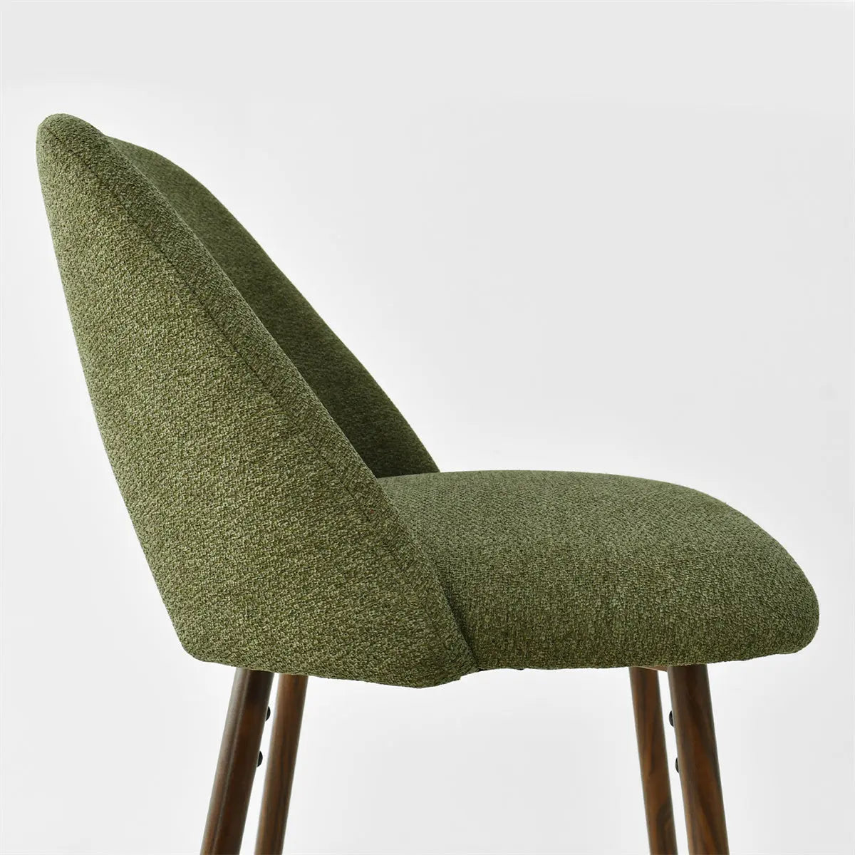 Edwin Modern Upholstered Counter Stool in green, side view, wooden legs, minimalist design.