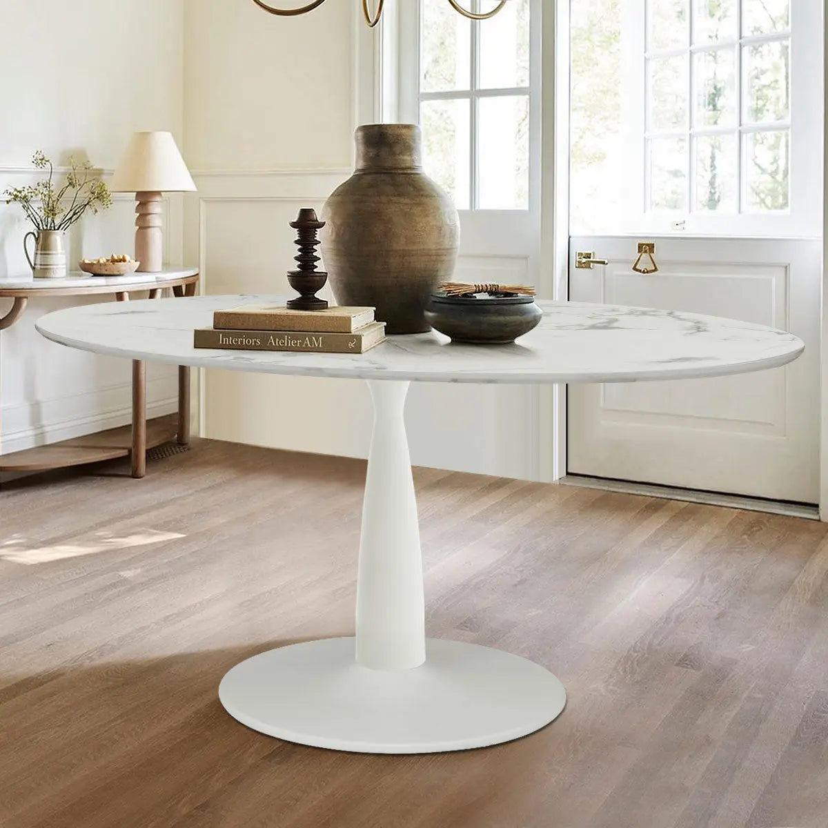 Harris 79" modern oval faux marble dining table in minimalist room with wooden flooring, decorative vases.