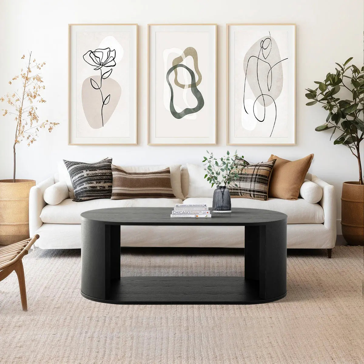 Hobo Coffee Table with Black Oval Design, Beige Sofa, Abstract Wall Art, Neutral Living Room Decor.