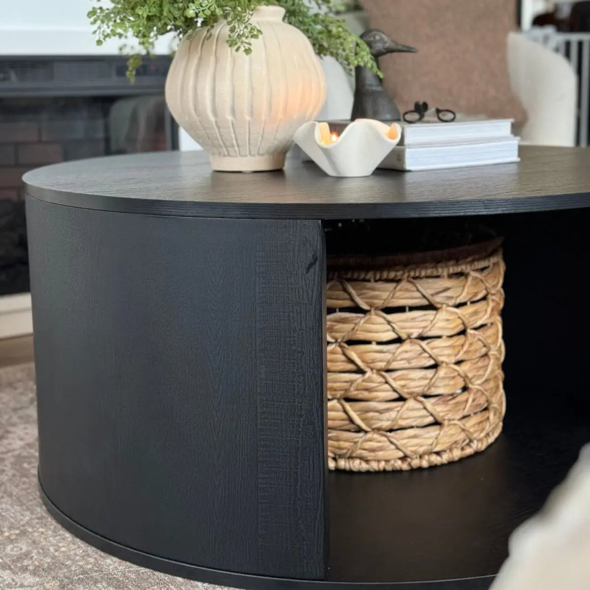 Hobo Modern Black Coffee Table in cozy living room with woven basket, neutral-colored rug.