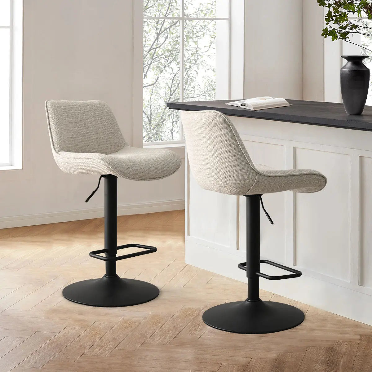 Hunter Modern Upholstered Swivel Counter Stool set, light wood floor, neutral kitchen with white paneling.