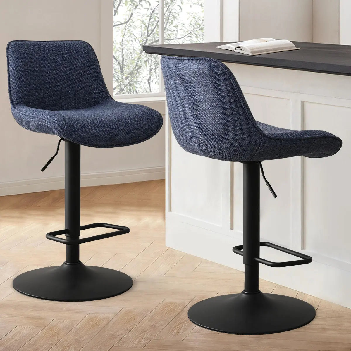 Hunter Modern Upholstered Swivel Adjustable Counter Stool in kitchen with light wood flooring and white walls.