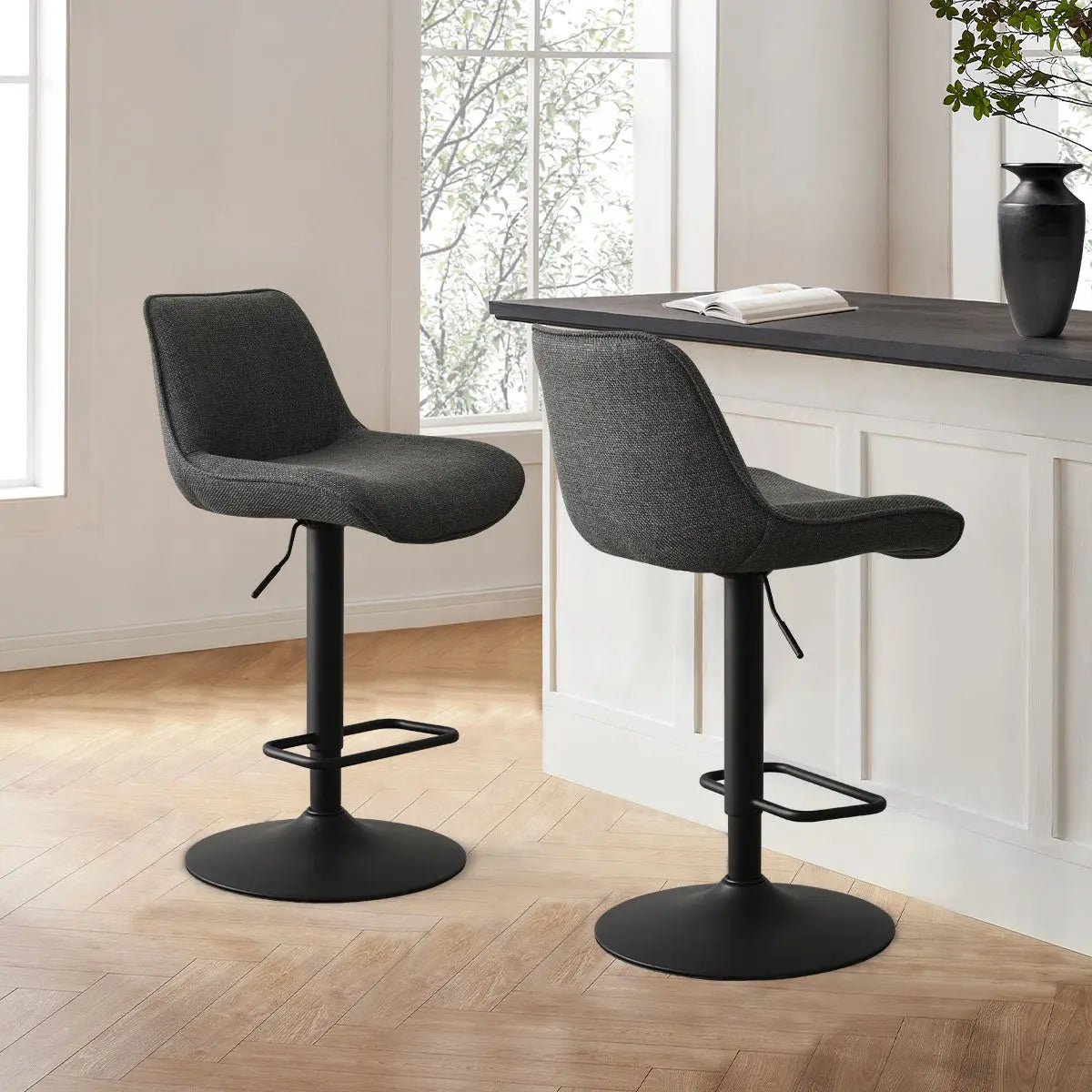 Hunter Modern Upholstered Swivel Counter Stools in stylish kitchen with light wood flooring.